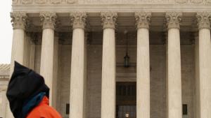 hooded Guantanamo protester in front of Supreme Court