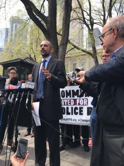 Darius Charney speaking at rally